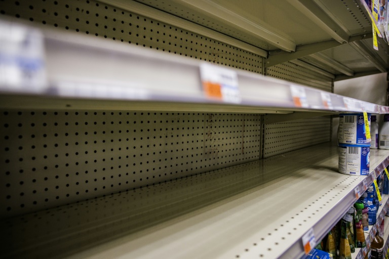 Shelves normally meant for baby formula sit nearly empty at a store in downtown Washington, DC, on May 22, 2022 Shelves normally meant for baby formula sit nearly empty at a store in downtown Washington, DC, on May 22, 2022