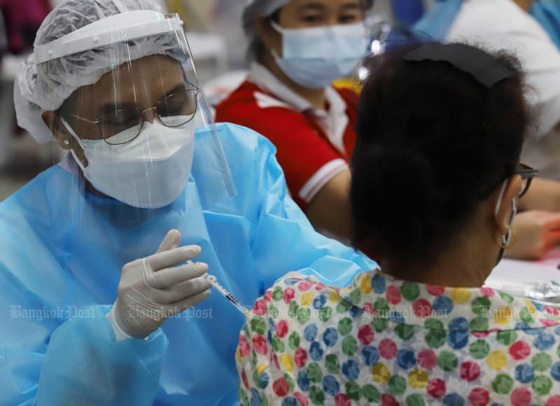 A woman gets a Covid-19 shot at Bang Sue Grand Station in Bangkok on June 5. (Photo: Apichit Jinakul)