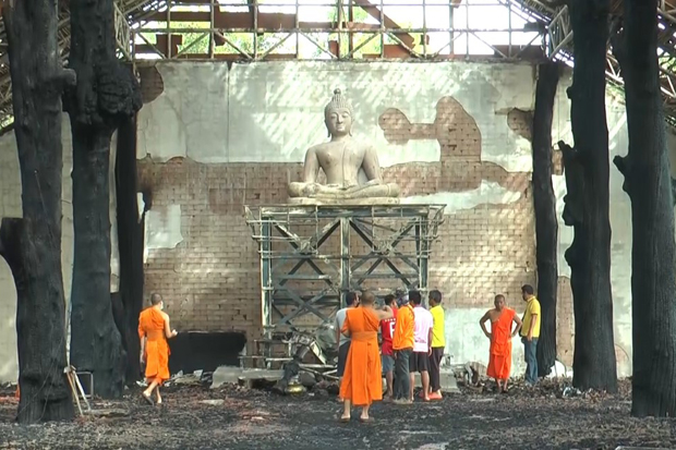 The main Buddha image in the sermon hall at Wat Buaboon Prachasamakkhi in Muang district of Buri Ram province escaped damage from a fire that burnt down the building on Sunday. (Photo: Supachai Piraksa)