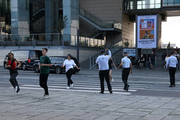 Security personnel usher people away from the Fields shopping centre. Security personnel usher people away from the Fields shopping centre.