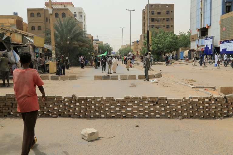 Sudanese anti-coup protesters gather on a blockaded street during a sit-in outside al-Jawda hospital in the capital Khartoum Sudanese anti-coup protesters gather on a blockaded street during a sit-in outside al-Jawda hospital in the capital Khartoum
