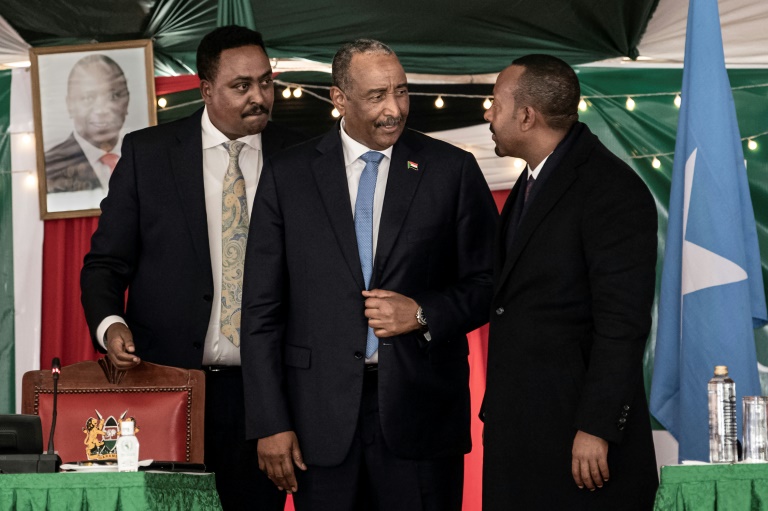 Al-Burhan and Ahmed, centre and right, met in Nairobi on Tuesday. Behind them is IGAD's executive secretary, Workneh Gebeyehu Al-Burhan and Ahmed, centre and right, met in Nairobi on Tuesday. Behind them is IGAD's executive secretary, Workneh Gebeyehu