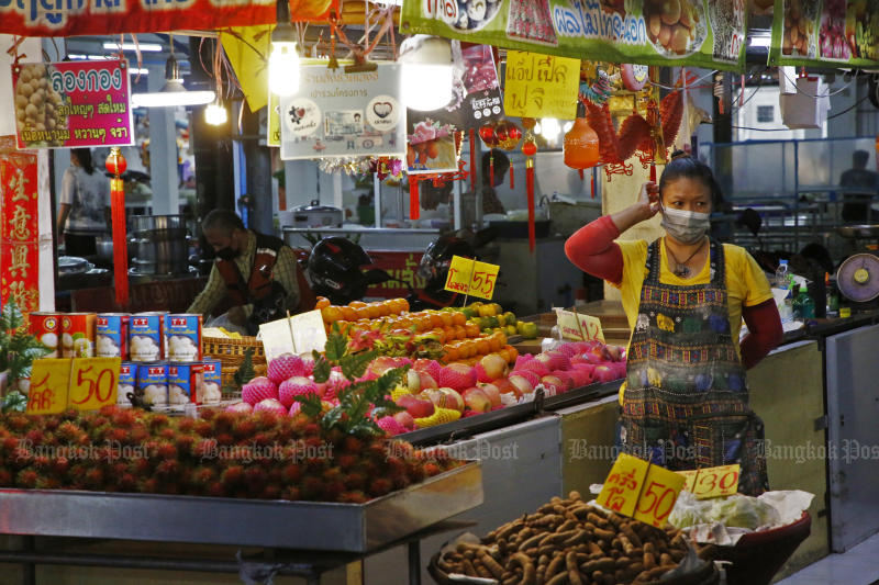 A vendor sells her wares at Bang Khae fresh market in Bang Khae district on April 17, 2022. The rising inflation, largely due to oil price hikes, affects people's spending. (Photo: Arnun Cholmahatrakool)