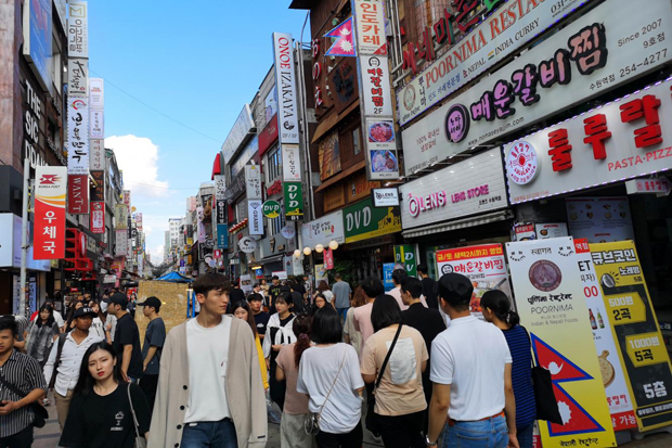 Crowds of people in the business district of Suwon, south of Seoul. While many illegal workers, including Thais, are known to live in Suwon, most prefer to steer clear of crowded areas to avoid police checks.