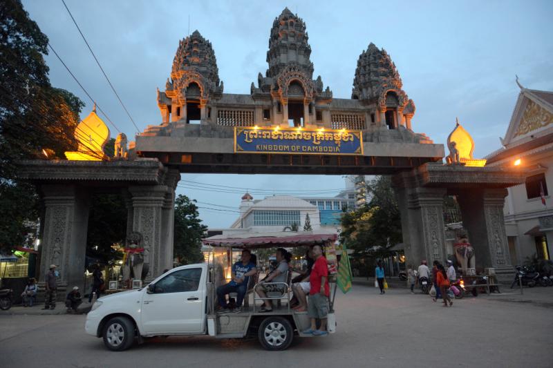 In a picture taken on June 19, 2014, a car transports Thai people along a street in the Thai-Cambodian border city of Poipet, in the northeastern Cambodian province of Banteay Meanchey, home to several casinos popular with Thais. (AFP)