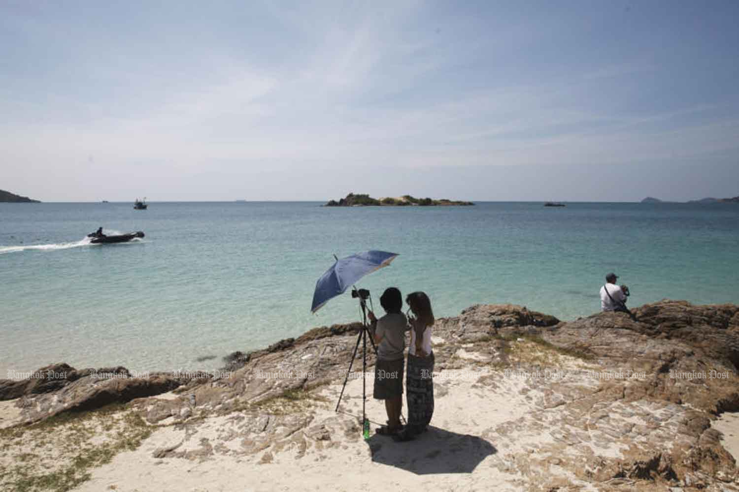 Visitors enjoy the view from Koh Samae San, off Chon Buri province. (Bangkok Post file photo)