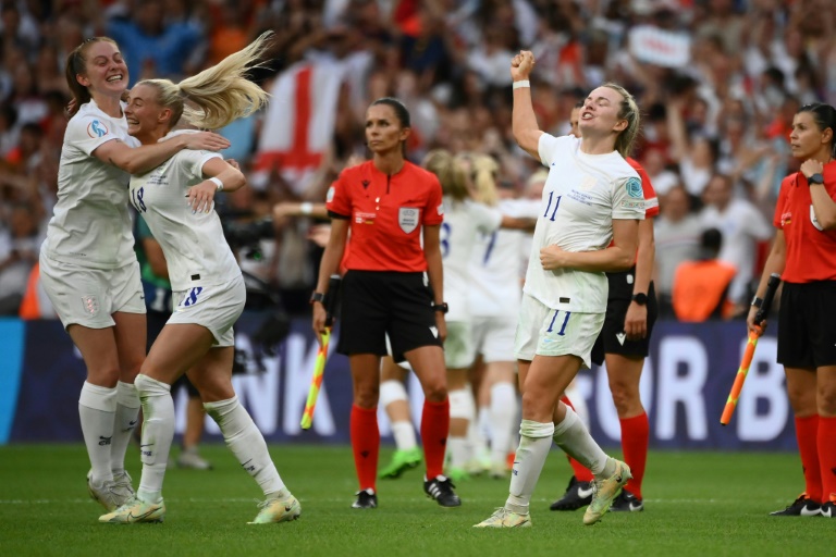 Champions: England players celebrate victory Champions: England players celebrate victory