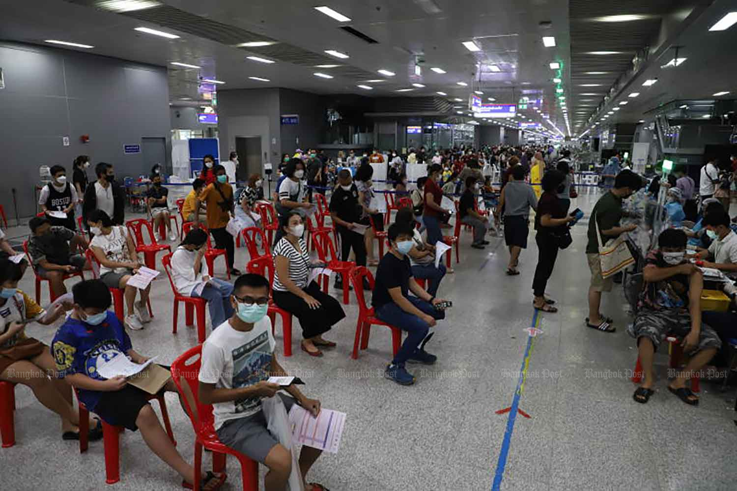 People receive Covid-19 vaccination at Bang Sue Grand Station in Bangkok on July 24. (Photo: Wichan Charoenkiatpakul).