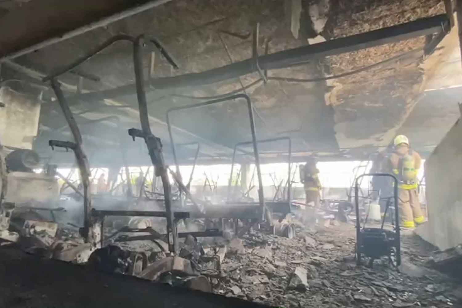 The fire-gutted third floor of the building, and remains of burned golf carts, at the Summit Wind Mill Golf Club in Samut Prakan's Bang Phli Yai district on Wednesday morning. (Photo: Sutthiwit Chayutworakan)