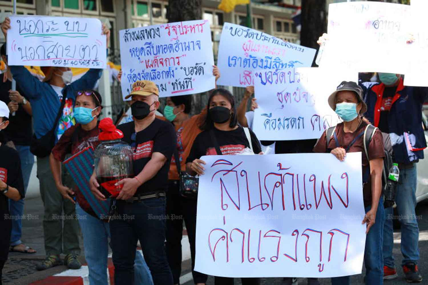 Workers' representatives rally at Government House last month, demanding a wage rise as the cost of living spirals upwards. (Photo: Apichart Jinakul)