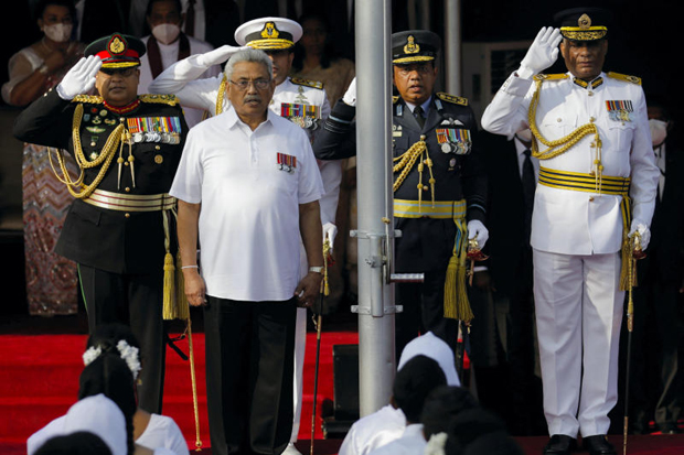 Gotabaya Rajapaksa (left) sings the national anthem during the country's 74th Independence Day celebrations in Colombo on Feb 4, 2022. He resigned as president in July after fleeing the country. (Reuters photo)