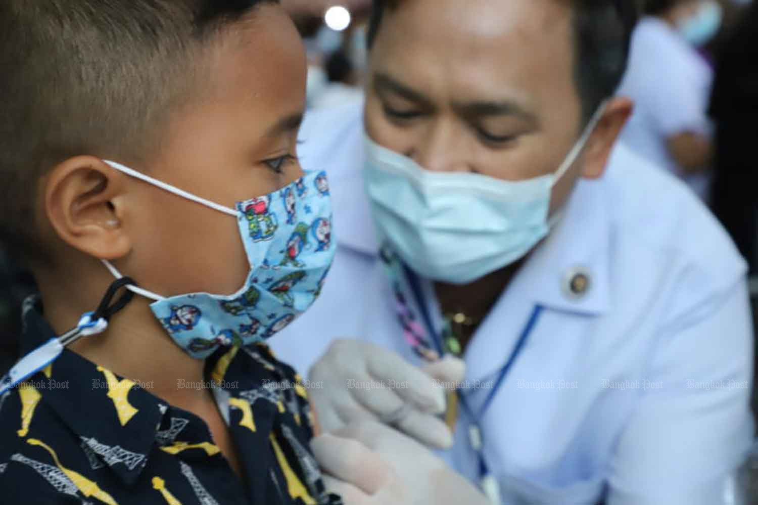 A health worker vaccinates a boy against Covid-19 in Nonthaburi province on Aug 4. (Photo: Pattarapong Chatpatarasill).