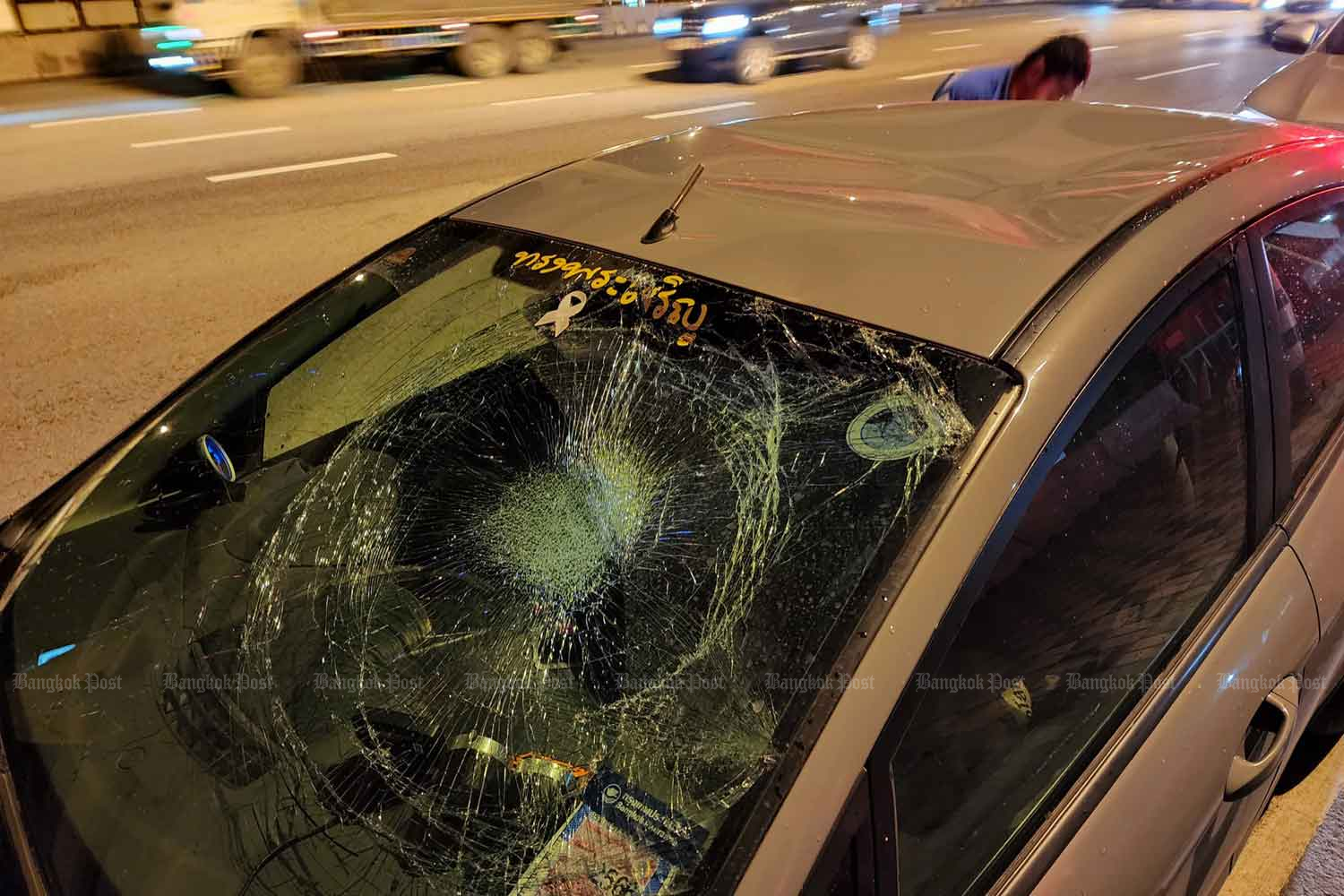 The car was damaged after being hit by a large amount of rainwater falling with a protective sheet on Rama II Road in Bang Khun Thian district, Bangkok, on Thursday night. (Photo: Facebook page of Nitiphan Wongraksa)