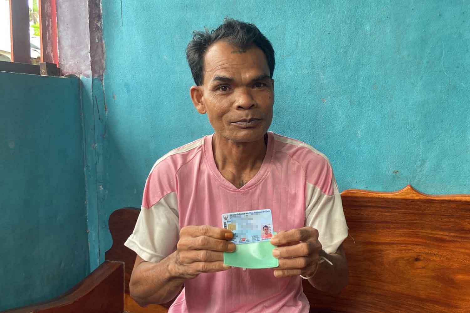 Sena Sriphet, 48, shows the ID card he waited 30 years for, at his house in Pa Kham district, Buri Ram, on Sunday. (Photo: Surachai Piragsa)