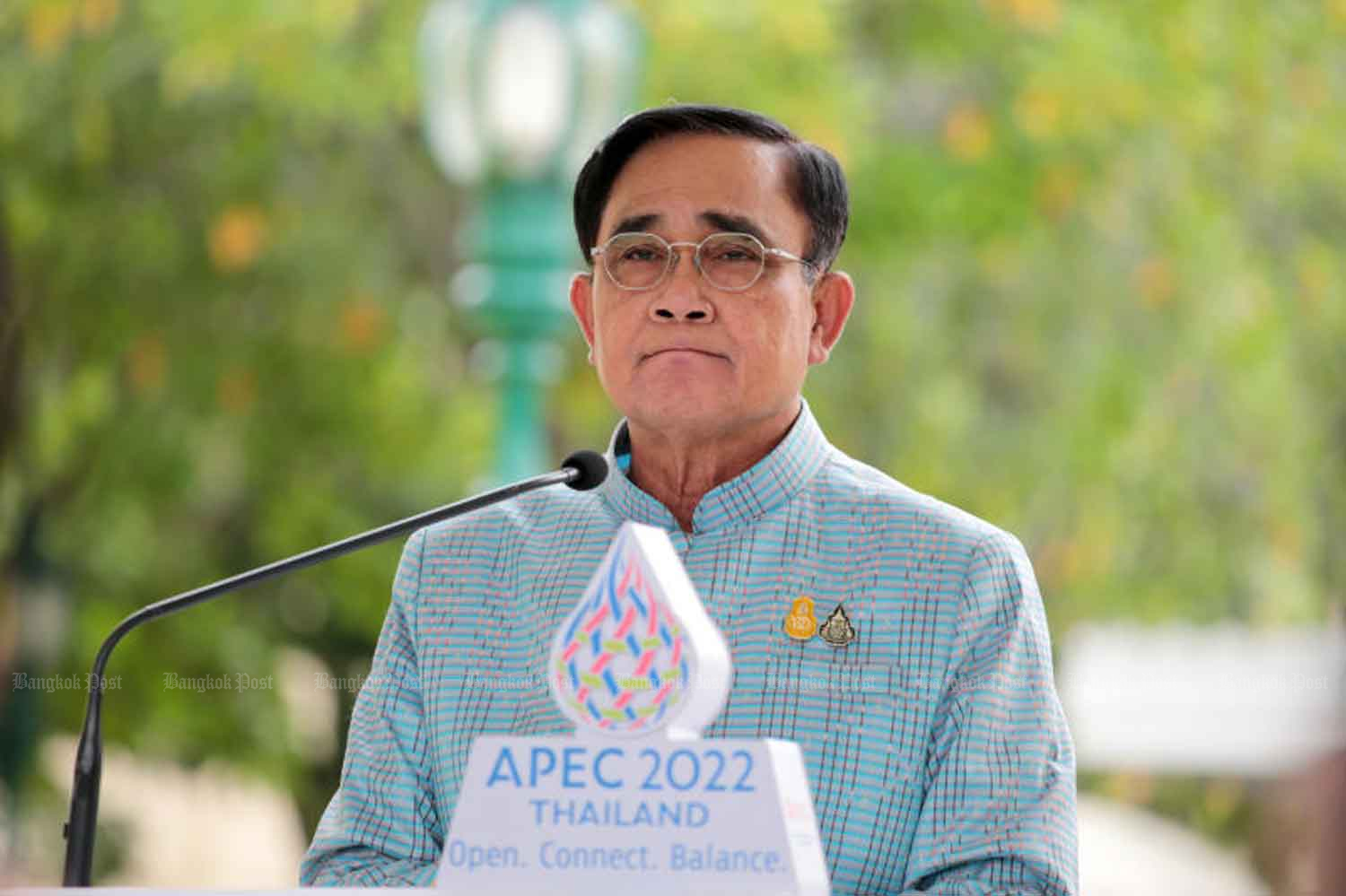 Prime Minister Prayut Chan-o-cha listens to questions from reporters at Government House after his weekly cabinet meeting on Tuesday. The premier announced additional government measures to ease people’s living costs amid rising prices. (Photo: Chanat Katanyu)