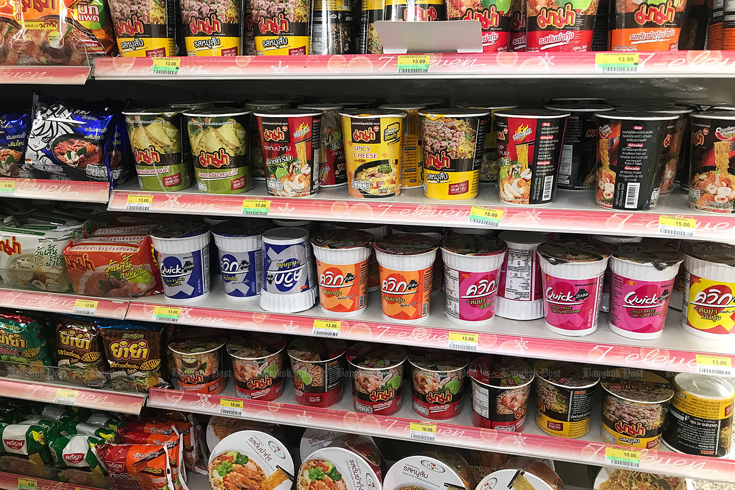 A variety of instant noodle products displayed on shelves at a convenience store in Bangkok. (Photo: Pattanapong Hirunard)