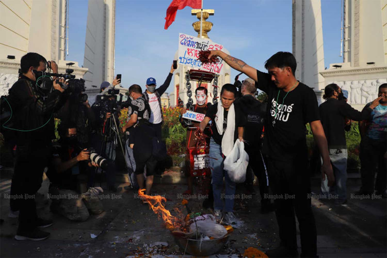 Demonstrators hold an activity against Prime Minister Prayut Chan-o-cha over his eight-year tenure at the rally site at the Democracy Monument on Tuesday evening as groups of protesters rallied to oust him. (Photo: Wichan Charoenkiatpakul)