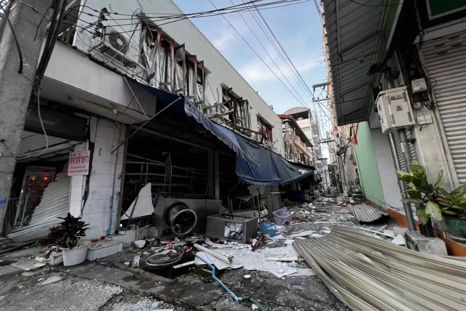 Debris litters the alley after the explosion at a food shop in Pattaya early on Tuesday. A migrant worker was injured. (Photo: Chaiyot Pupattanapong)