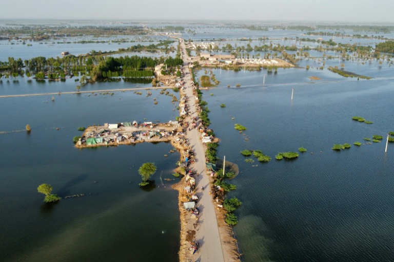 An aerial photograph shows makeshift tents along a road in a flooded part of Jaffarabad district in Balochistan. An aerial photograph shows makeshift tents along a road in a flooded part of Jaffarabad district in Balochistan.
