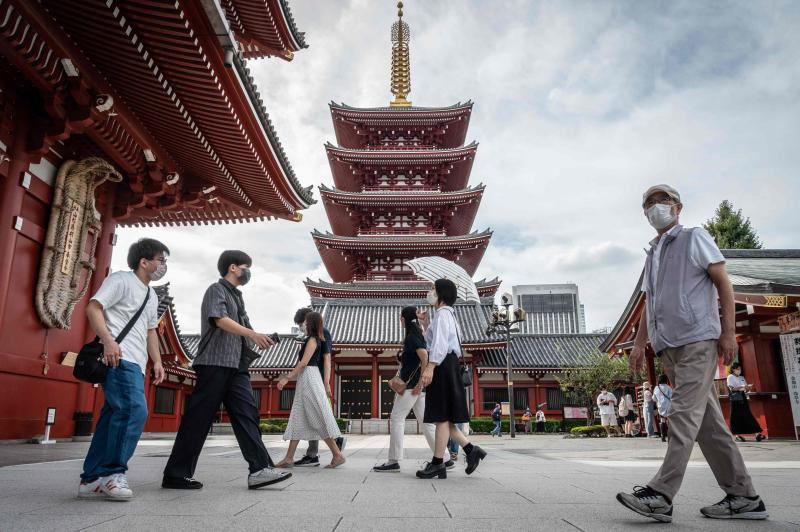 People visit Sensoji Temple, a popular tourist location, in Tokyo on Tuesday. (AFP photo)