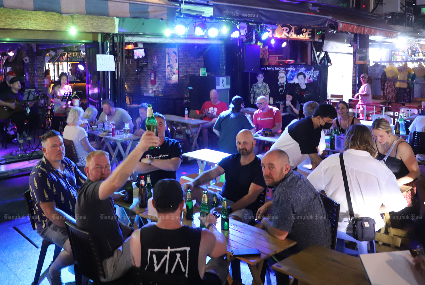 Tourists enjoy the nightlife on Khaosan Road in Bangkok on Sept 23. (Photo: Pornprom Satrabhaya)