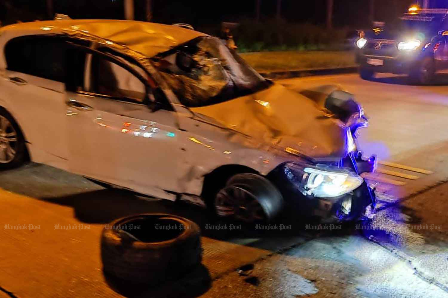 The wrecked BMW sedan after the accident. It was driven by a 15-year-old boy who ran a red light and hit and killed a motorcyclist at an intersection in Muang district, Nakhon Ratchasima, on Sept 30. (Police photo)