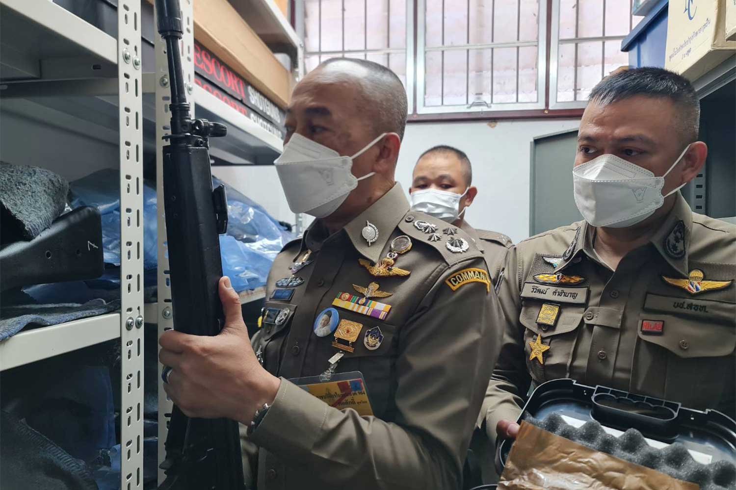 Deputy national police chief Pol Gen Torsak Sukvimol inspects firearms at the arms storage room of a police station. (Photo supplied/Wassayos Ngamkham)