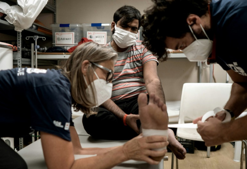 Bangkok Post Three migrants jump into sea in Italy port standoff