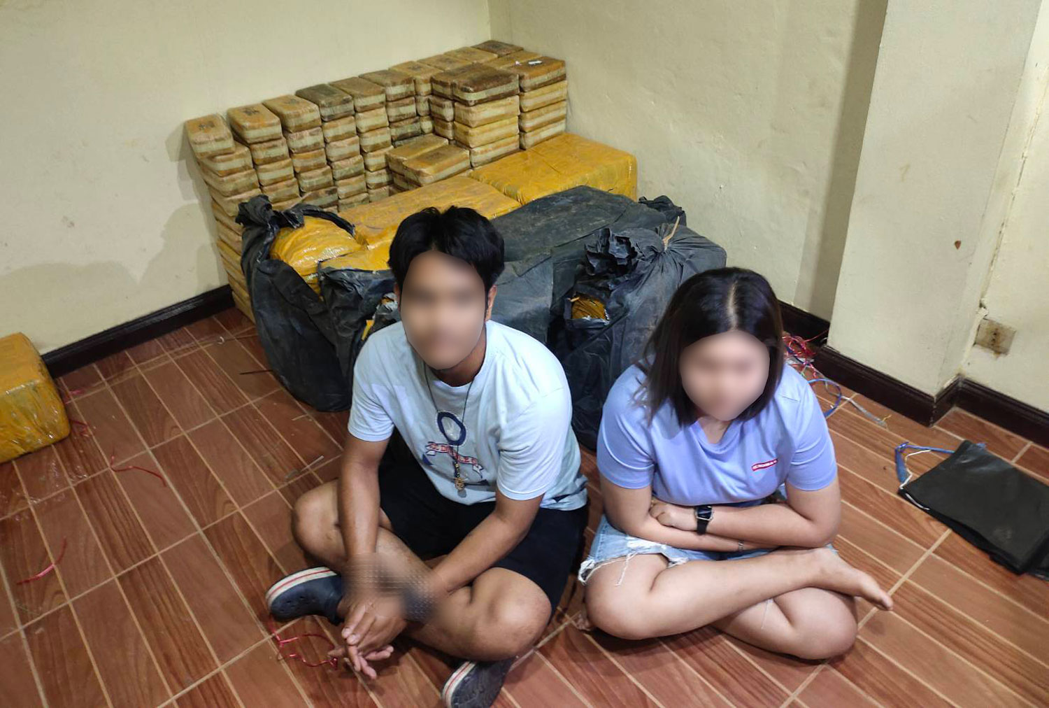 Witthaya Suksathian and his wife, Waranya Panthong, are in custody after nearly 3.7 million speed pills were found in a godown they had rented in in Wang Noi district of Ayutthaya. (Photo supplied/Wassayos Ngamkham)