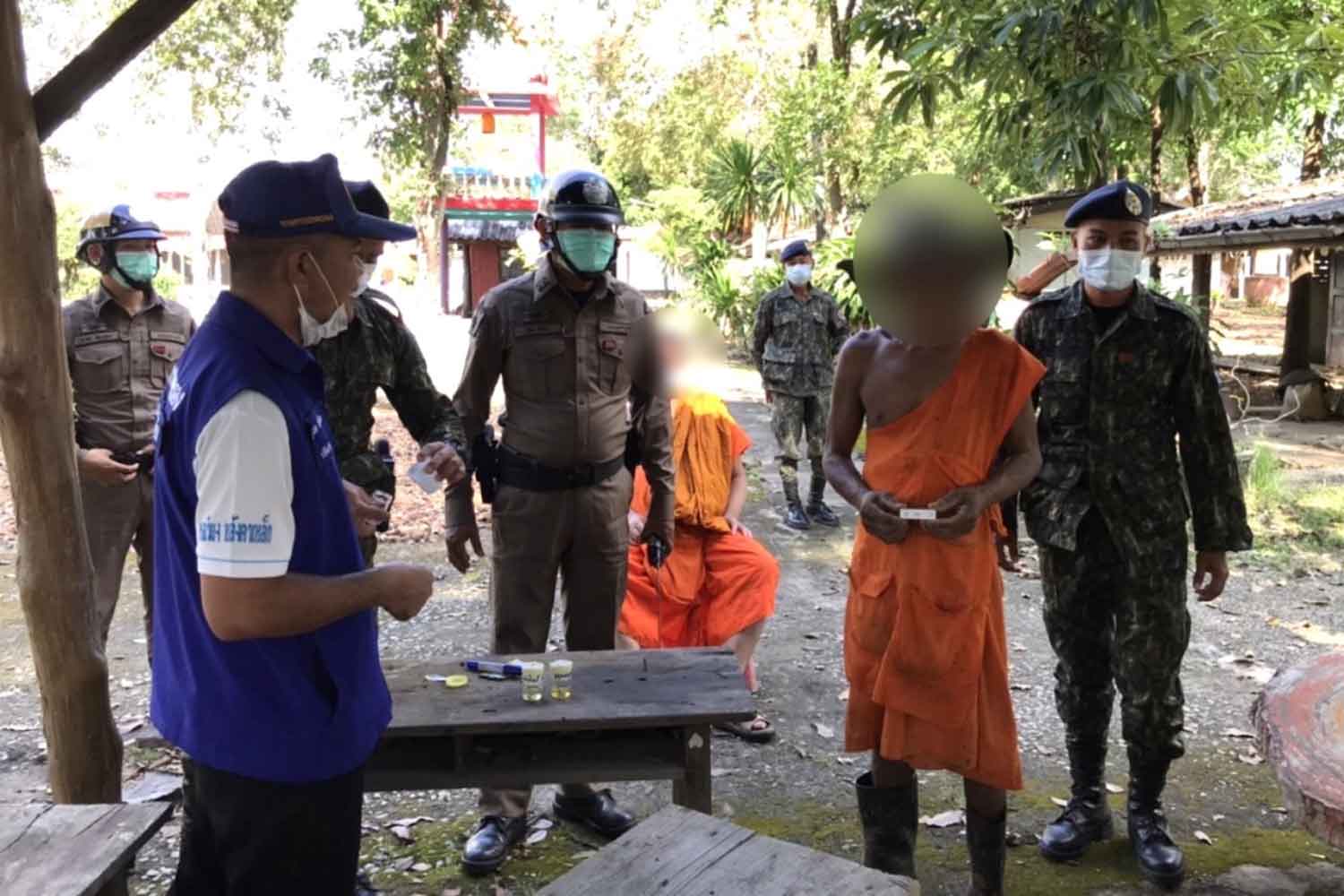 Monks at a temple in Bung Sam Phan district, Phetchabun province, took urine tests in a raid on Monday. All tested positive for illegal drugs and were forced to leave the monkhood. (Photo: Sunthorn Kongvarakhom)