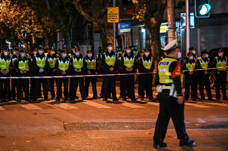 Police officers block Wulumuqi street, named for Urumqi in Mandarin, in Shanghai, where protests have taken place against China's zero-Covid policy Police officers block Wulumuqi street, named for Urumqi in Mandarin, in Shanghai, where protests have taken place against China's zero-Covid policy