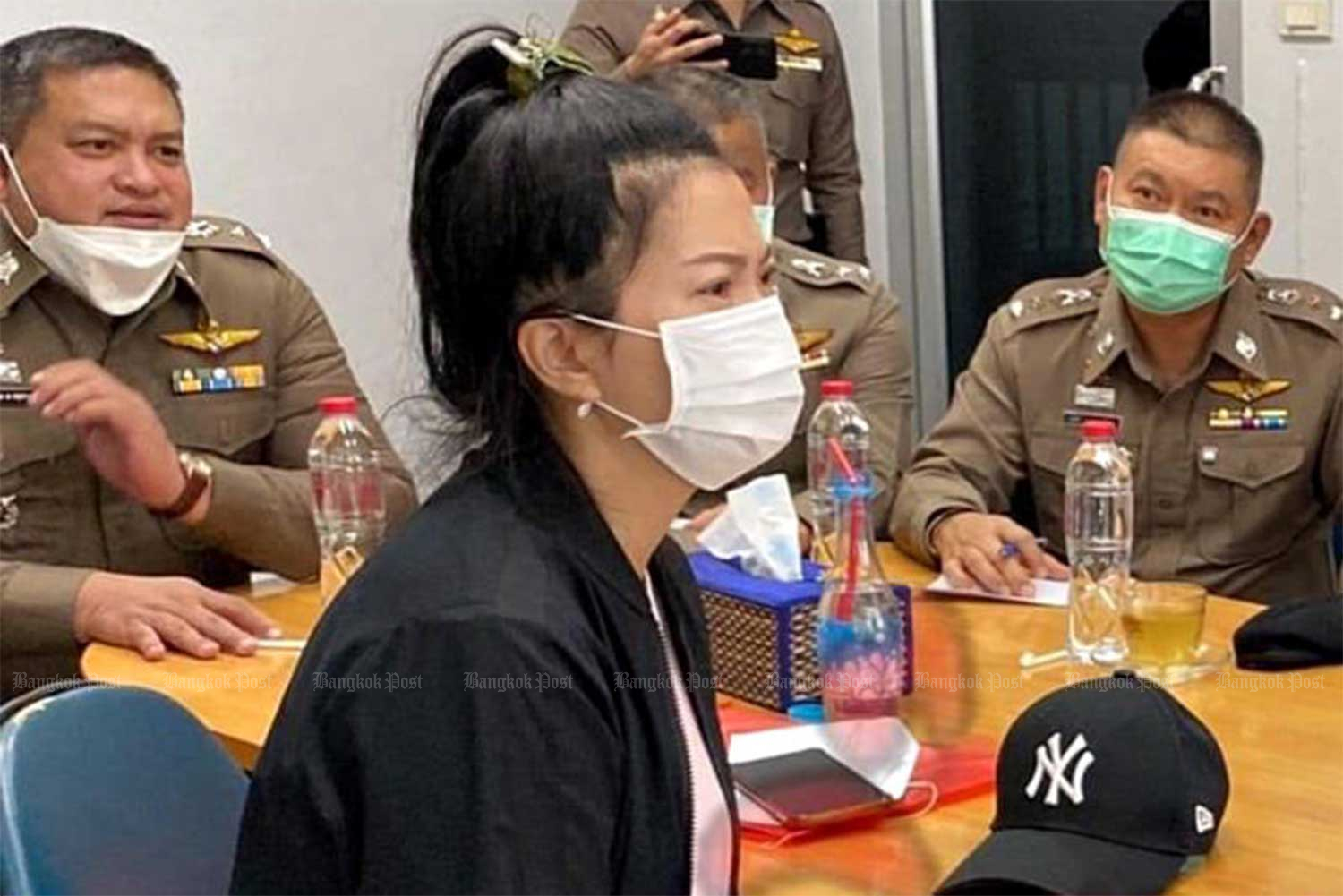 Pol Cpl Kornsasi Buayaem is interrogated by police at Muang police district station in Ratchaburi on Aug 20. (Police photo)