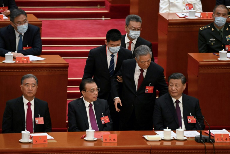 Hu Jintao (2nd right) had not appeared in public since he was dramatically escorted out of a top Communist Party meeting at which Xi Jinping (right) was handed a historic third term as leader.