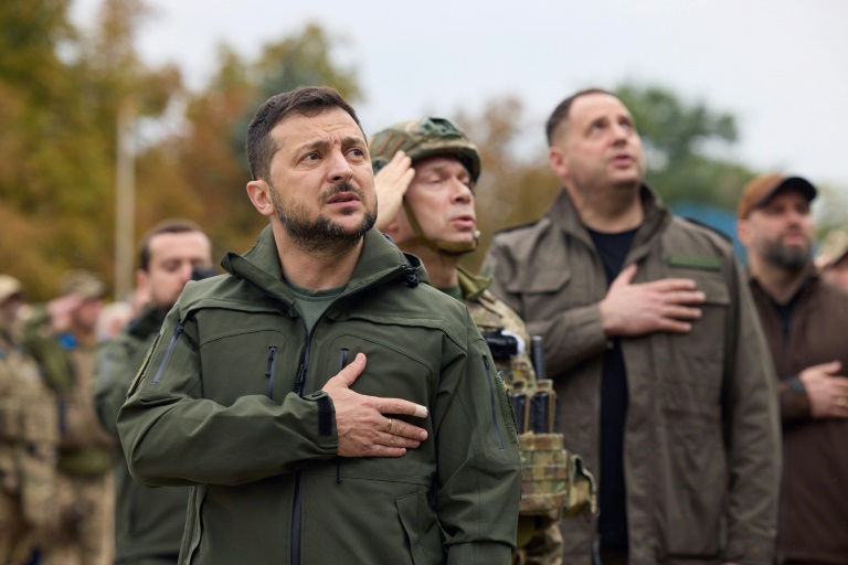 Ukrainian president Volodymyr Zelensky takes part in a flag raising in the de-occupied city of Izyum, Kharkiv region in September 2022. Ukrainian president Volodymyr Zelensky takes part in a flag raising in the de-occupied city of Izyum, Kharkiv region in September 2022.