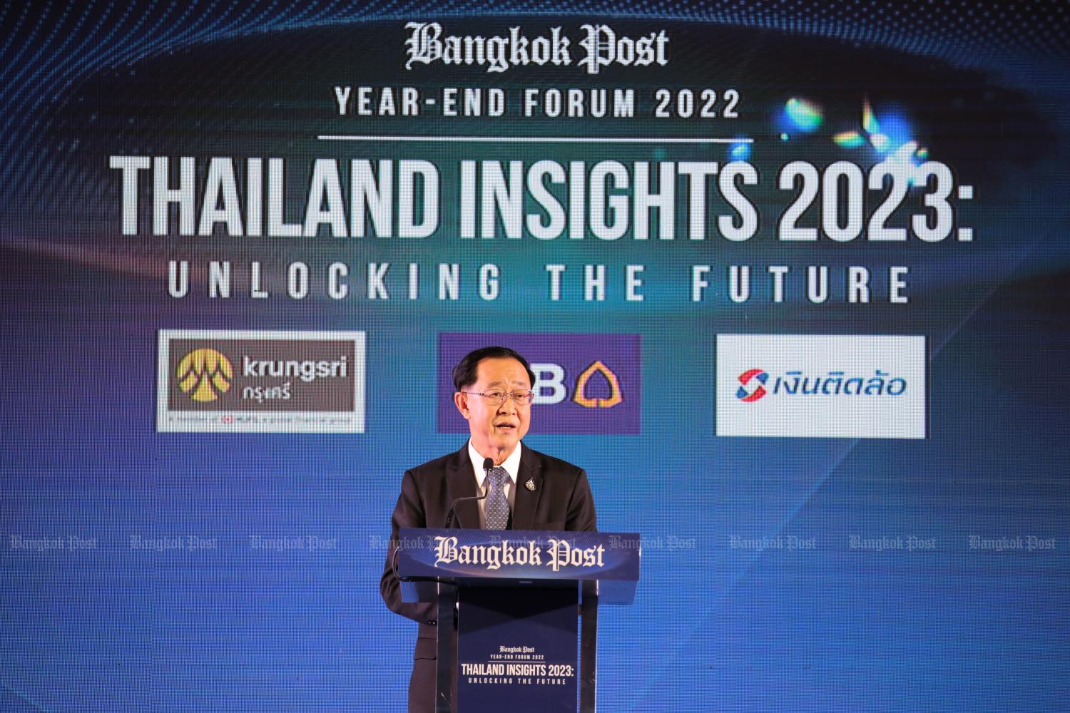 Finance Minister Arkhom Termpittayapaisith on Wednesday gives the keynote address at the Bangkok Post Year-End Forum 2022. (Photo: Chanat Katanyu)