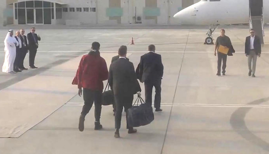 This video grab taken from a footage shown by Russian state media that AFP could not independantly authentify shows American basketball star Brittney Griner, left, during a swap of prisoners with Viktor Bout, second from right, a Russian notorious arms dealer on Thursday on the tarmac of Abu Dhabi airport, the United Arab Emirates (UAE). (Photo: AFP)