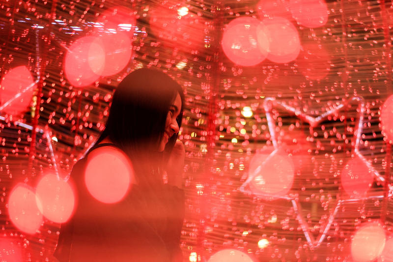 A woman visits illuminated decorations assembled ahead of Christmas and New Year's celebrations at the CentralWorld department store on Thursday. (Reuters photo)