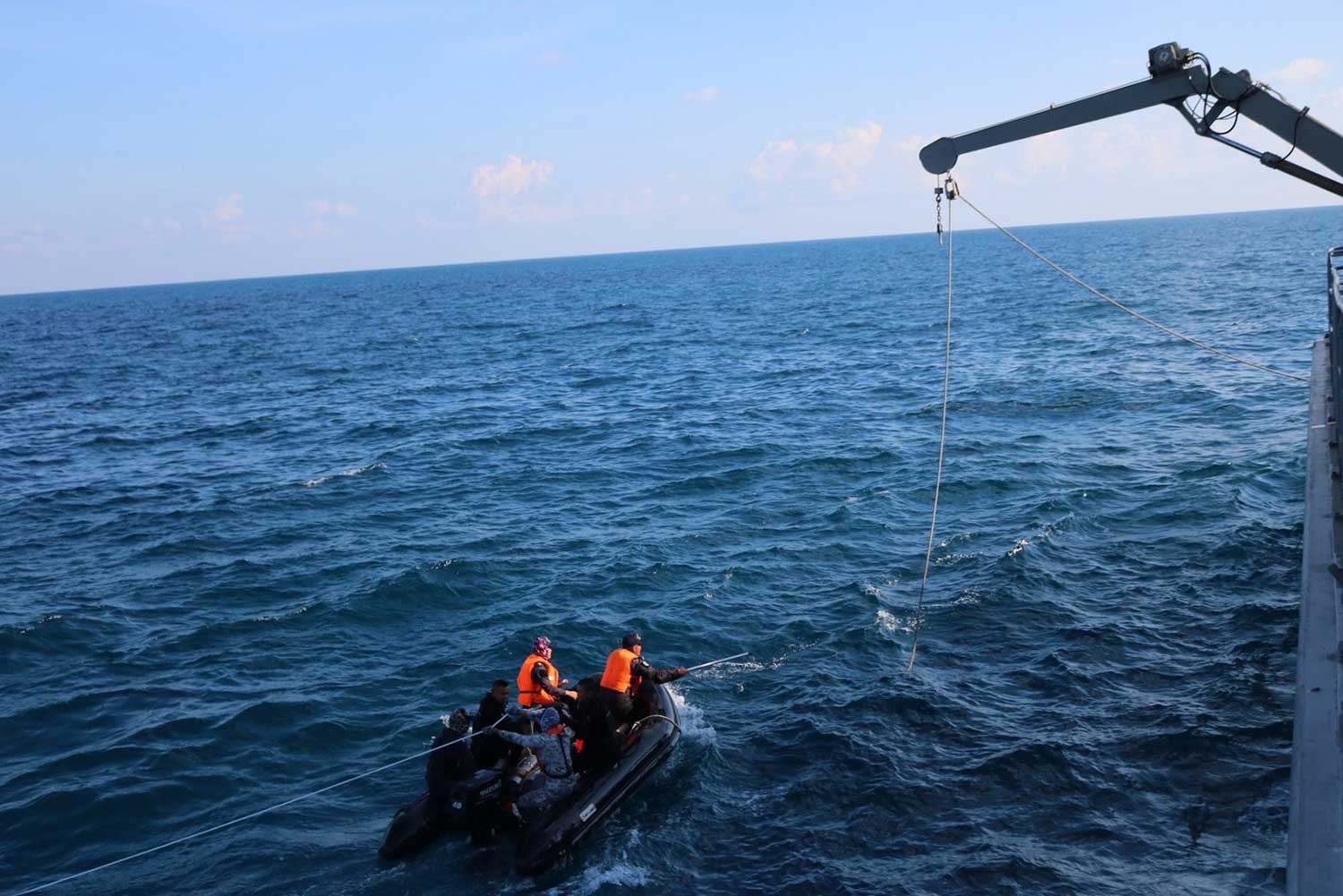 Navy officers from HTMS Bang Rachan search for the 23 sailors still officially listed as missing from the sunken corvette HTMS Sukhothai in the Gulf of Thailand as the mission continues into its fifth day on Friday. (Photo supplied/Wassana Nanuam)