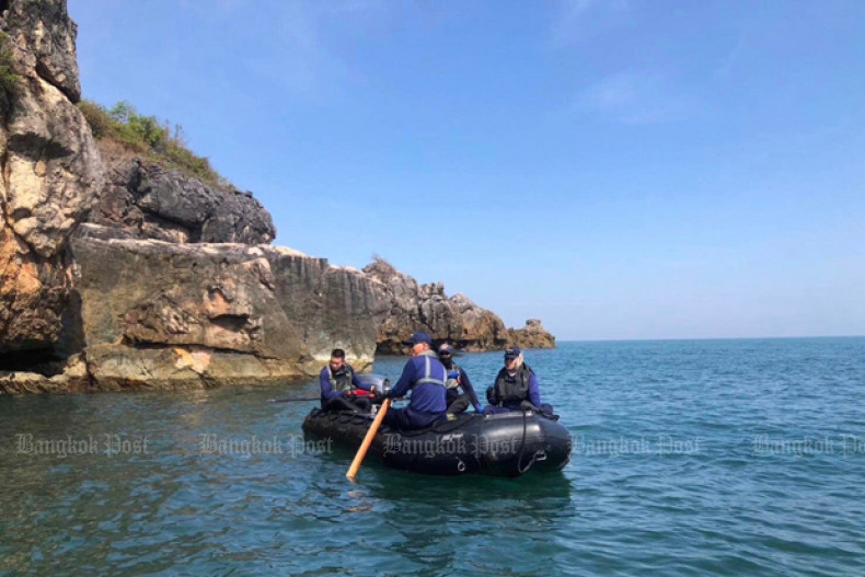 Searchers man an inflatable boat as they wait for divers to surface off an island in Chumphon province on Friday as the search for bodies from HTMS Sukhothai continues. (Photo: Royal Thai Navy Facebook account)