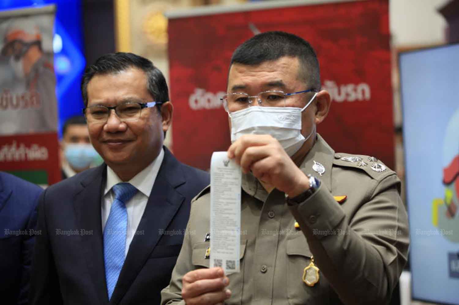 National police chief Pol Gen Damrongsak Kittiprapas shows a ticket sample while elaborating on a demerit point system for drivers last month. (Photo: Apichart Jinakul)