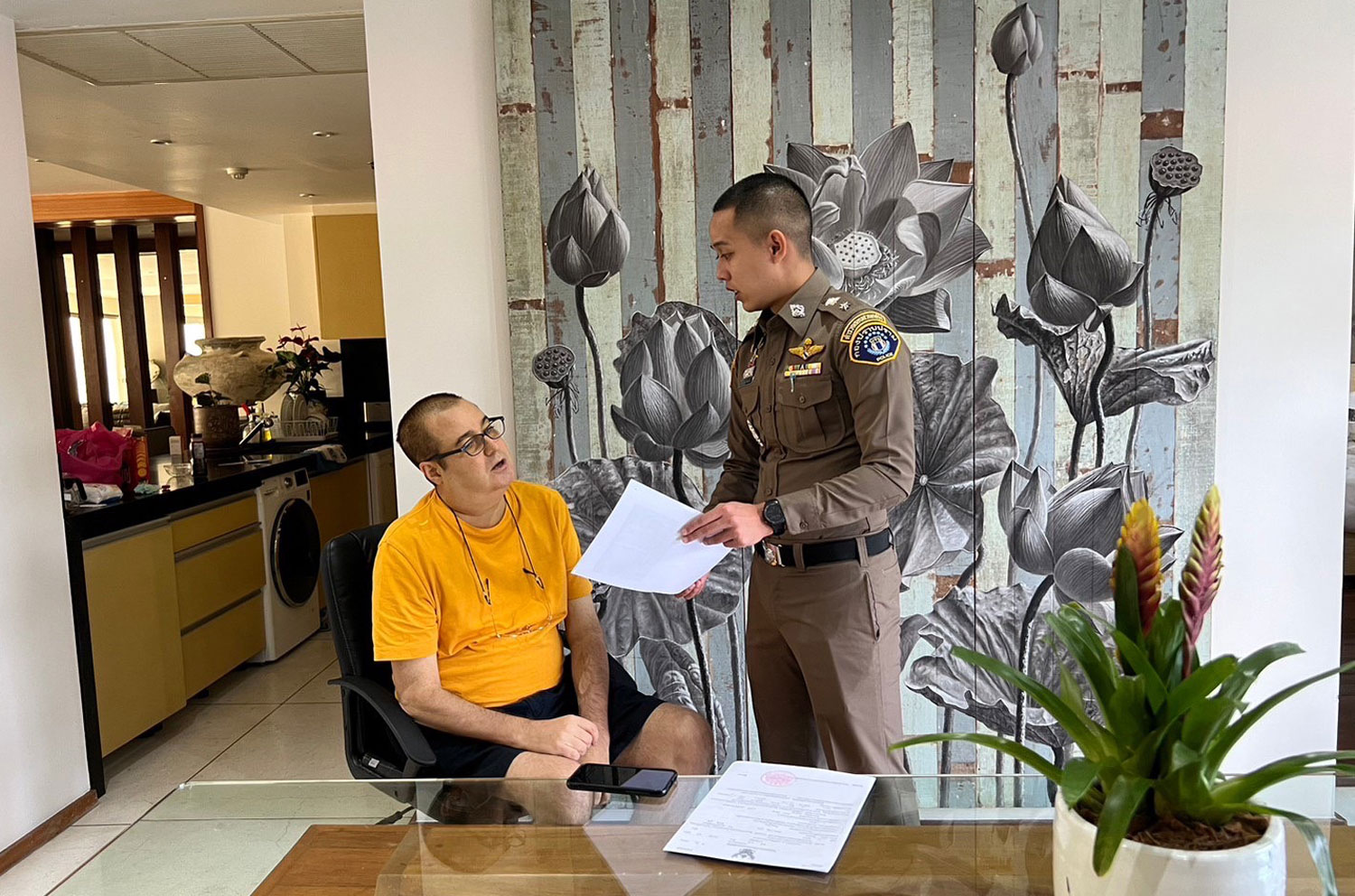 Peter Coker Jr, 54, a citizen of St Kitts and Nevis, wanted by US for fraud and stock manipulation, is arrested in a hotel room near Surin beach in Thalang district of Phuketon Wednesday. (Photo supplied/Wassayos Ngamkham)