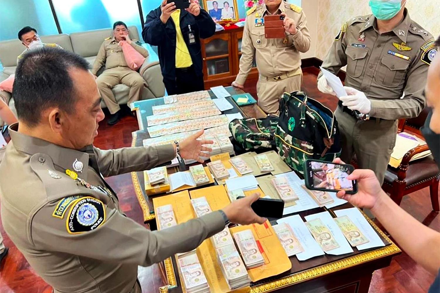 Police search the office of then Department of National Parks, Wildlife and Plant Conservation head, Rutchada Suriyakul Na Ayutya. (Police Photo)