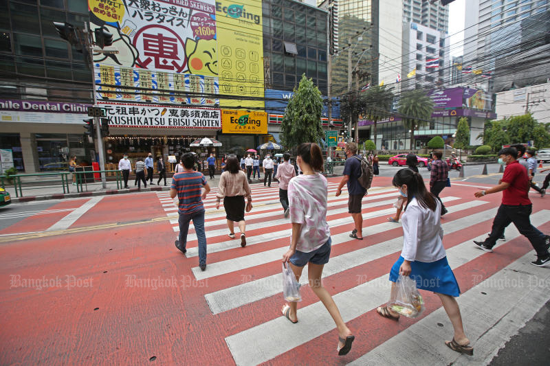 Pedestrians cross Asoke Montri Road near Terminal 21 shopping mall, Bangkok. (Photo: Varuth Hirunyatheb)