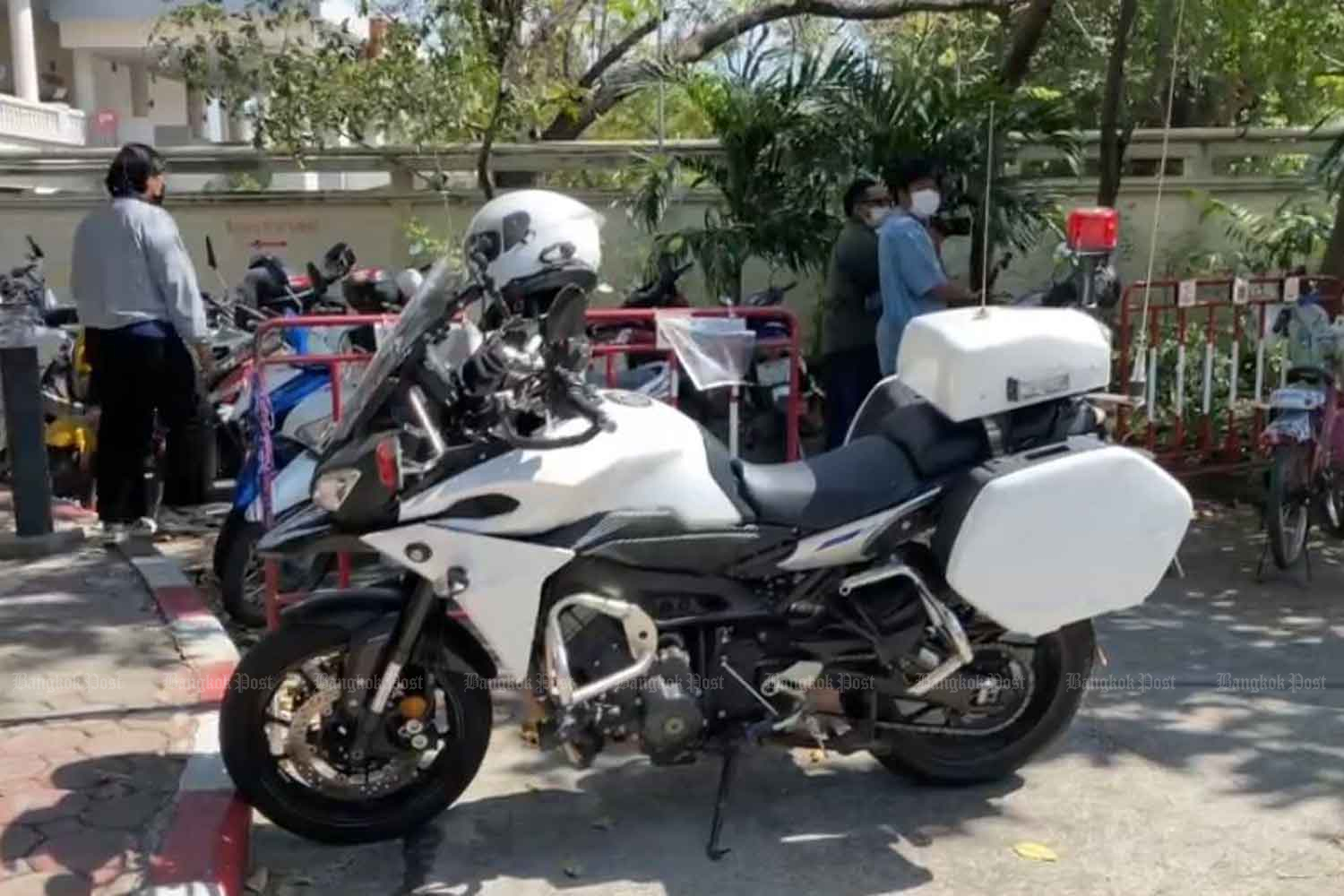 A white Yamaha MT-09 motorcycle is parked at the Traffic Police Division in Bangkok on Sunday. It was believed to be involved in the controversial escort service claimed by a Chinese visitor. (Photo supplied)