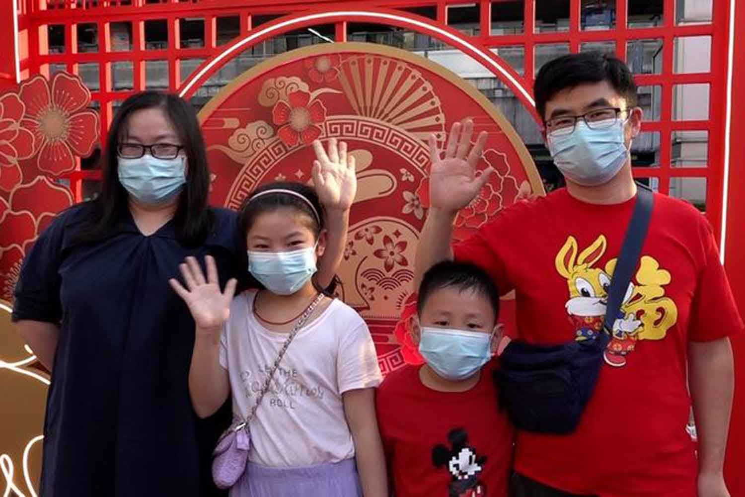 A still; from a video taken on Jan 20 shows Chinese tourists posing for photos with a Chinese Lunar New Year decoration outside a shopping centre in Bangkok. (Thana Nuntavoranut/Xinhua)