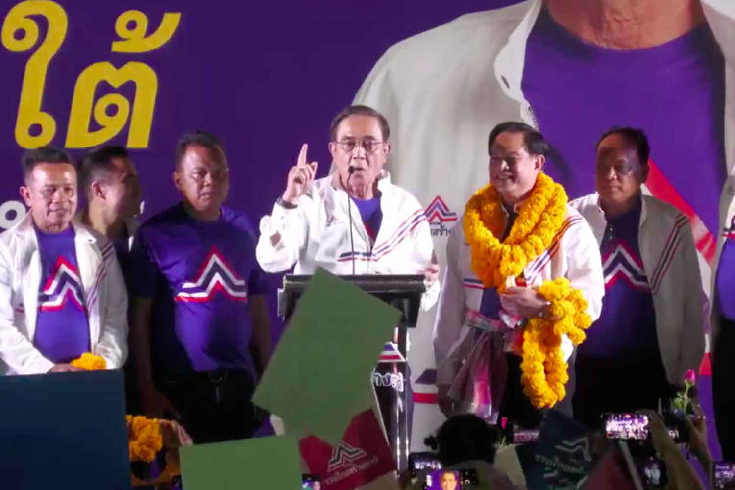 Prime Minister Prayut Chan-o-cha speaks to a packed gathering of supporters at his first election campaign address as member of the United Thai Nation (UTN) Party in Chumphon on Saturday. (Screenshot)