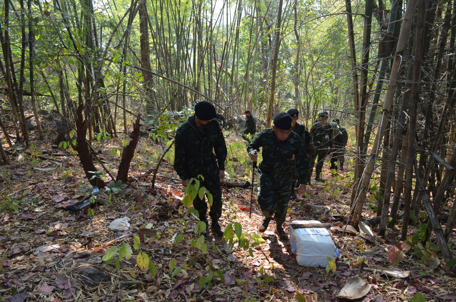 Soldiers inspect the scene of the clash in Chiang Dao district, Chiang Mai, on Thursday. (Photo supplied/ Panumet Tanraksa)