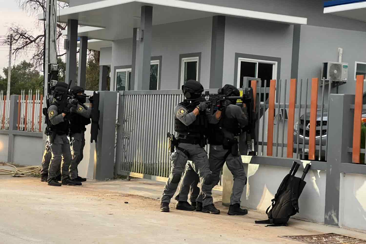 Crime Suppression Division (CSD) police raid a house in Roi-et's Thawat Buri district on Sunday morning, where they arrested a suspected petrol station thief. (Photo supplied)