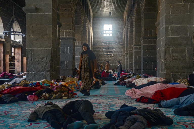 Dozens of families that fled Syria's civil war are taking shelter from the earthquake in Turkey in the ancient mosque at Diyarbakir. (Photo: AFP)