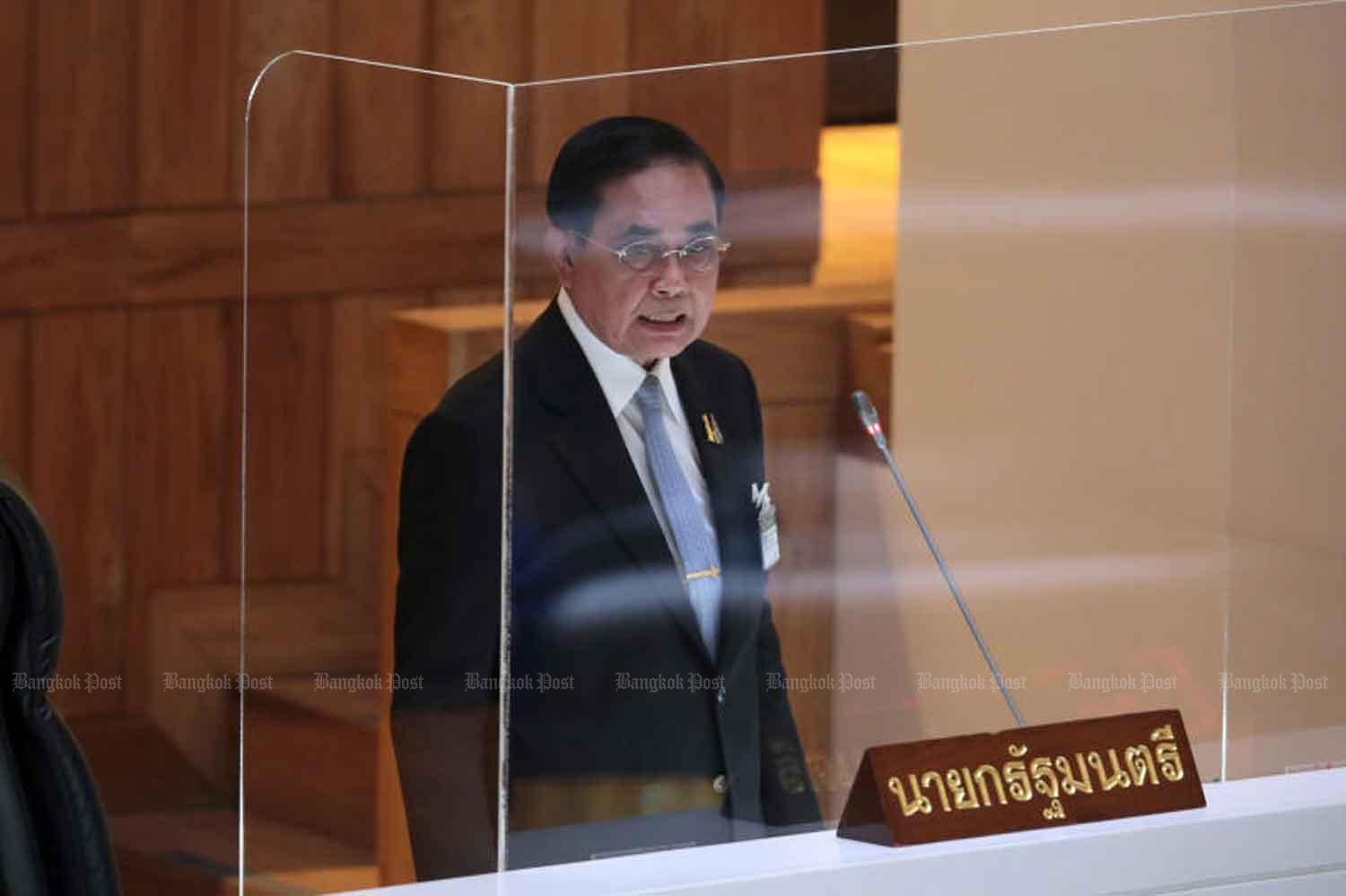 Prime Minister Prayut Chan-o-cha speaks to the House of Representatives on Feb 16. (Photo: Chanat Katanyu)